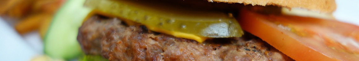 Eating Burger Cheesesteak Pub Food at Live Oak Grill restaurant in Sugar Land, TX.